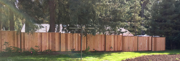privacy fence 6 foot stepped with top rail